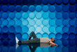 © Rendara Studio - Relaxing man by blue wall 3D structure