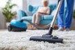 © Prazis Images - Caregiver Cleaning a Carpet with a Vacuum Cleaner for a Senior Person
