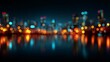 © KP - Cityscape bokeh lights reflecting on water at night. A stunning display of lights. The city skyline is blurred and glows in the night. The water reflects the vibrant lights