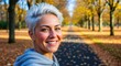 © The Little Hut - Smiling Woman with Gray Hair Enjoys Autumn Day in the Park, Demonstrating Confidence and Healthy Lifestyle