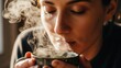 © Mauricio - A sensory close-up capturing a woman’s quiet moment of bliss as she inhales the fragrant steam rising from a hot cup of tea in soft, moody lighting.