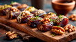 © Margo_Avvakumova - A wooden platter displays stuffed dates filled with nut butter, topped with walnuts and herbs. The scene features a healthy dessert ideal for clean eating and snacking.