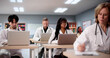 © Andrey Popov - Diverse Medical Students Using Laptops To Learn Technology