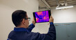 © Andrey Popov - Engineer Using Thermal Camera To Check Heat Loss