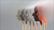 © Kristina - Conceptual burnout illustration with matchsticks shaped as human heads burning out in sequence