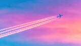 Sky filled with airplane trails during sunset in a colorful sky