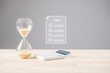 © sorapop - Tax sandglass shows time running out, calculator ready for business money management, deadline approaching for corporate income payment and financial year invoice due day