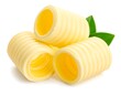 © Hp - Close-up of three butter curls with two green leaves, arranged on a white background, showcasing texture and yellow hue
