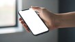 © Nunung - Hand Holding Modern Smartphone with Blank White Screen, Mockup Concept