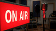 © MBAK NAH - Bright red ON AIR sign illuminating a broadcast studio.