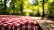 © ArmStrong☠ - Picnic table with red and white checkered tablecloth. Blurred nature background. Wooden bench