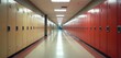 © Maryna - Long school hallway with yellow and red lockers. Empty corridor in high school or college. Bright lighting illuminates the scene. Interior shot of the educational institution space.