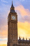 Elizabeth Tower clock face on the Palace of Westminster, historic London landmark against a sunset sky
