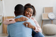 © Prostock-studio - Happy millennial african american woman holding house keys, hugging boyfriend in their new apartment after buying real estate, free space. Own apartment, great rent, moving, successful deal indoor