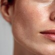 © rinrada - Macro image of sensitive facial skin with redness and natural texture on white background