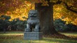 © Saiyam - Stone guardian lion in autumn park