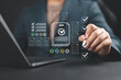 © Nirusmee - Businessman checking off a digital checklist on a virtual interface, representing task management, workflow optimization, productivity, audit, compliance, and digital transformation.