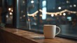 © sablengjago - A cozy coffee mug sits on a wooden windowsill overlooking city lights at dusk