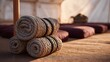 © Bussakon - Rolled thick ropes and maroon floor cushions are neatly arranged inside a rustic canvas tent illuminated by soft warm morning light