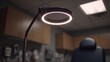 © Justlight - Medium shot of indirect overhead lighting softly enhancing a clinical room focused on a clean exam chair blurred in the background for patient comfort.