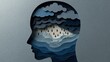 © Kristina - Depressed human head silhouette with storm clouds and rain in paper cut style representing mental health issues