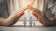 © Artfinity - Hands creating a protective roof over a paper family. Insurance and home protection concept. Person palms shielding a cut out family shape on a table with warm light
