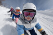 © Vika art - Children in snow sports gear skiing down a slope.