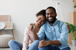 © Prostock-studio - Happy young black couple hugging and showing keys to new apartment with cardboard boxes, looking at camera after relocation. Buying own real estate, renting apartment, moving, positive emotions