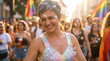 © Bruno Adachi - smiling older woman with short gray hair, wearing iridescent tank top, surrounded by bubbles, rainbow flags in background, crowd of people, sunlight, outdoor festival, colorful.