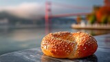 Simit Turkish sesame bread ring marble table Bosphorus bridge in background with soft fog minimalist cosy composition