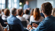 © Kateryna - Engaged faceless audience attending presentation focused learning taking notes corporate environment  professional development business training seminar