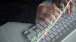 © InfiniteFlow - A business professional analyzes financial data with stock market graphs displayed over a computer keyboard, capturing the essence of data-driven decision-making. Copula