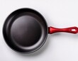 © John - a black frying pan with a red handle top view on white background