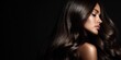 © Konstantin - Beautiful woman with long shiny healthy brunette hair isolated on black background highlighting elegance beauty skincare hairstyle cosmetic smooth perfection model portrait