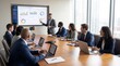 © Shahid - Diverse business team collaborating and presenting data analysis during a modern office meeting.