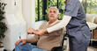 © OnPoint/peopleimages.com - Wheelchair, smile and nurse with old man in home for support, healthcare advice and hip fracture. Elderly care, medical assistance and multiple sclerosis with senior person with a disability in house