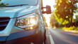 © MP-AI - Eco friendly delivery van headlight road transport sun glare urban street commute modern vehicle exterior detail safety travel