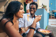 © Lomb - Multicultural friends eating pasta and drinking wine outdoors in Italy, summer vacation lifestyle