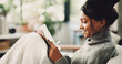 © BuyOutFelix06/peopleimages.com - Happy, notebook and writing with woman on sofa for inspiration, journal prompt and reminder. Reflection, agenda and planning with person in living room of home for diary, checklist and brainstorming