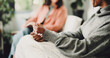 © BuyOutFelix06/peopleimages.com - Therapy, anxiety and hands of woman on sofa for counseling, assessment and support. Mental health, advice and progress with people in office for therapist session, trauma recovery and help discussion