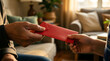 © Pragati - Grandparent giving red envelope to grandchild - Chinese New Year tradition for wealth and legacy