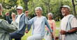 © DavidsPrime/peopleimages.com - Exercise class, smile and senior woman outdoor together with personal trainer for group training. Active, fitness or workout with coach and old people in park for demonstration, health or support
