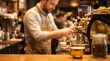 © Tina - Barista with beard and apron preparing espresso at coffee machine in cafe interior with coffee beans jar on counter.