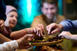 © .shock - Family enjoys iftar in a restaurant with Ramadan decorations and warm lighting during the holy month of Ramadan