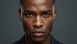 © Segati - A close-up portrait of a handsome African American man with a serious expression