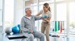 © crispy - Senior man lifting dumbbells with female physical therapist in gym. Rehabilitation exercise for injury recovery. Healthy lifestyle