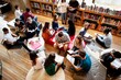 © Rawpixel.com - Diverse group of students studying in a library. Students reading, discussing, and collaborating. Library setting with books and study materials. High school students reading books in library.