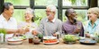 © Rawpixel.com - Diverse elderly friends, including Asian and African American, enjoying a meal together. Elderly friends laughing, sharing, and dining in a restaurant. Retired people having lunch at restaurant.