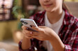 © New Africa - Teenage girl using smartphone at home, closeup