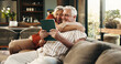© OnPoint/peopleimages.com - Hug, tablet and senior couple on sofa excited for good news, winning and website in home. Retirement, marriage and old man and woman on digital tech for online giveaway, bonding and relax together
